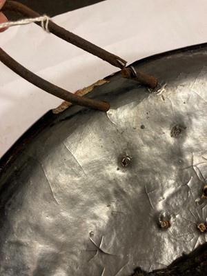 Lot 146 - A lacquered hide shield