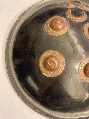 Lot 146 - A lacquered hide shield