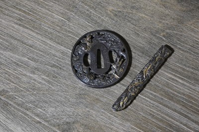 Lot 90 - A Japanese bronze tsuba and a kozuka