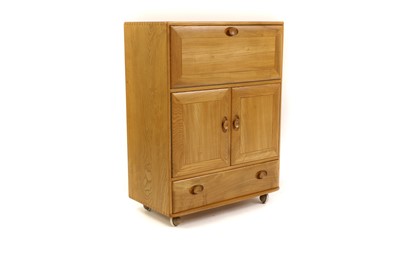 Lot 400 - An Ercol beech cocktail cabinet