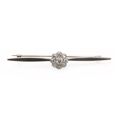 Lot 1033 - A white gold diamond cluster bar brooch