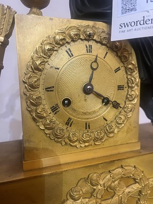 Lot 132 - An Empire ormolu mantel clock
