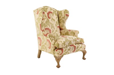 Lot 312 - A wingback armchair