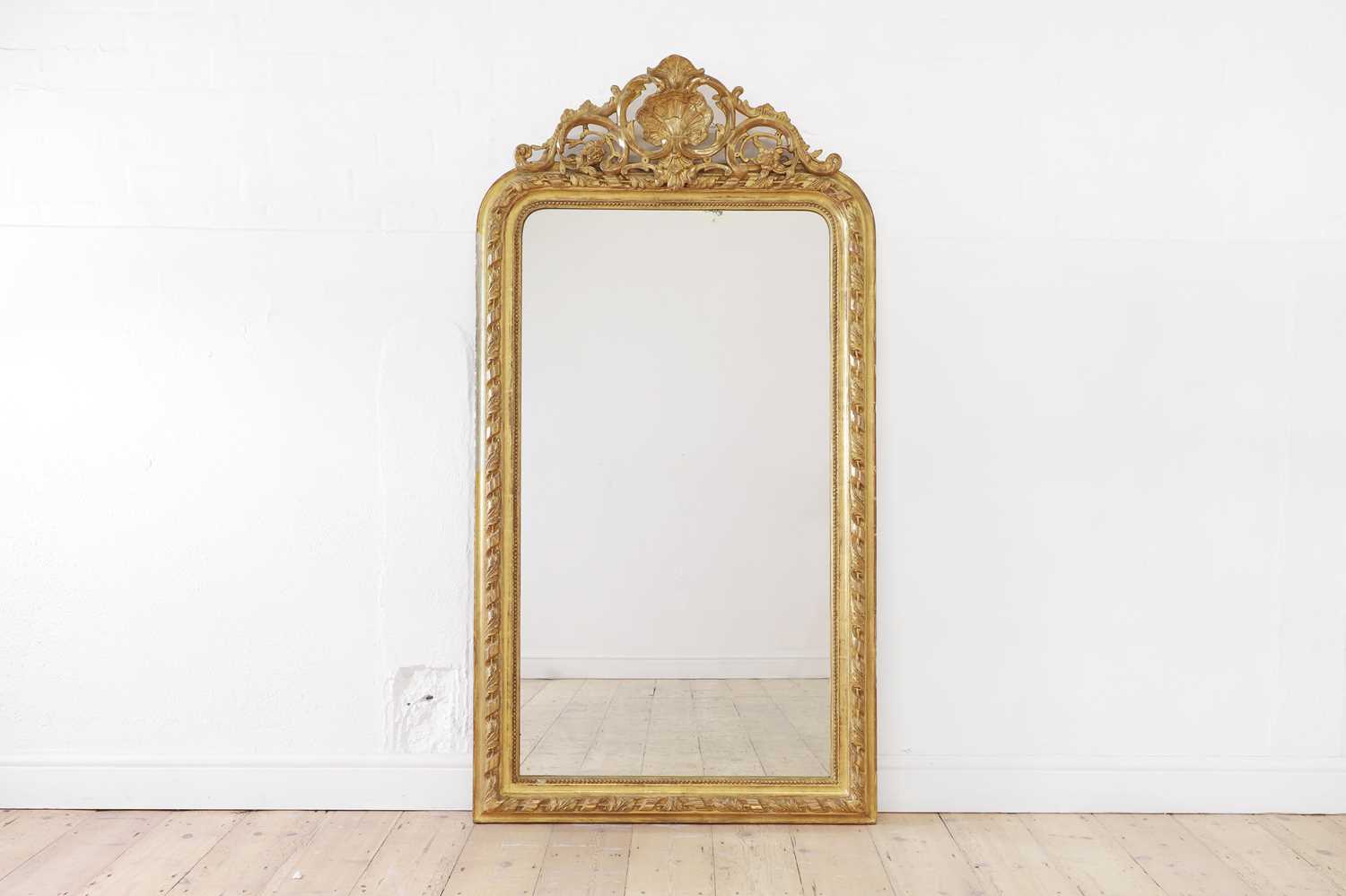 Lot 137 - A Louis XVI-style giltwood and gesso wall mirror