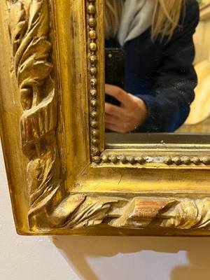 Lot 137 - A Louis XVI-style giltwood and gesso wall mirror