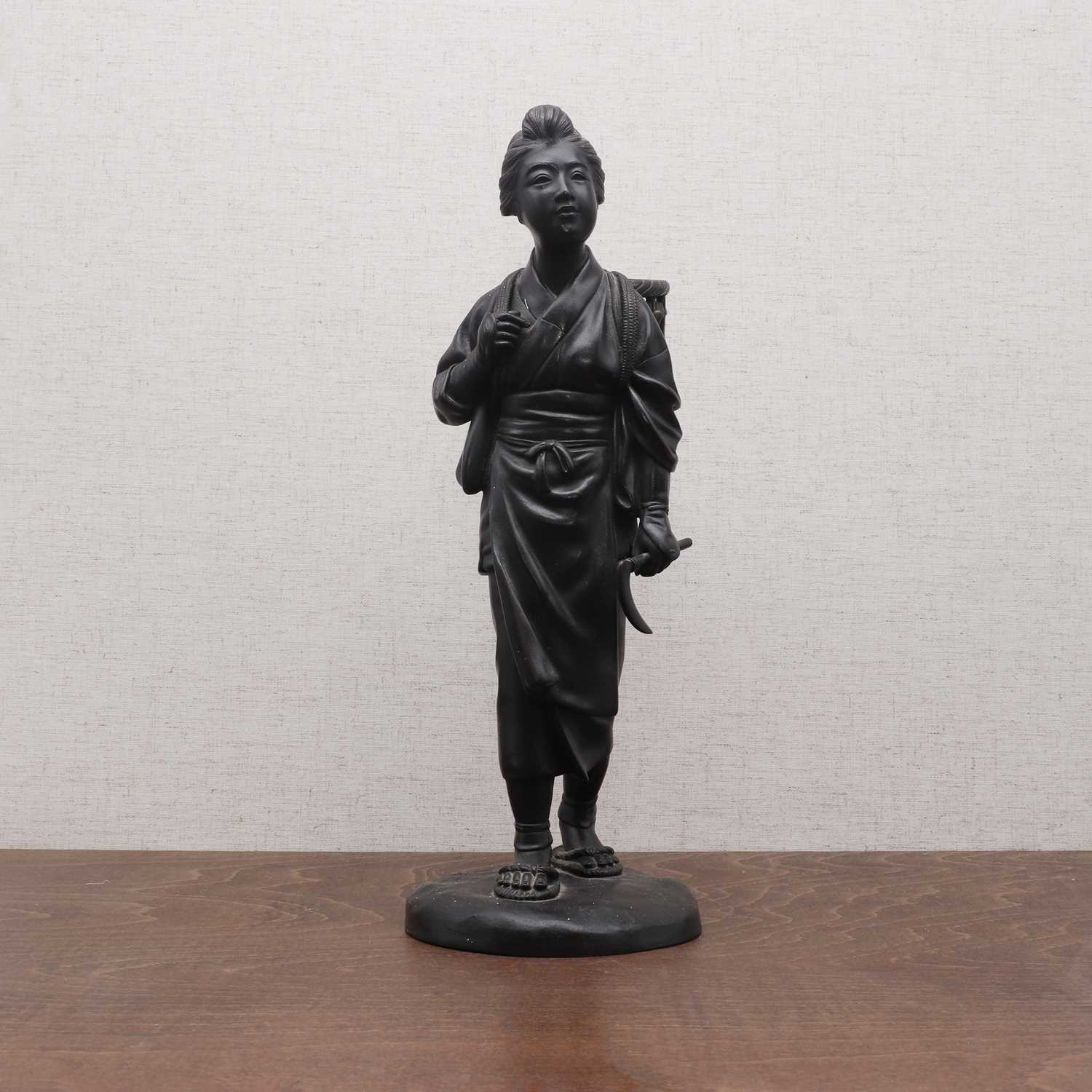 Lot 311 - A Japanese bronze okimono