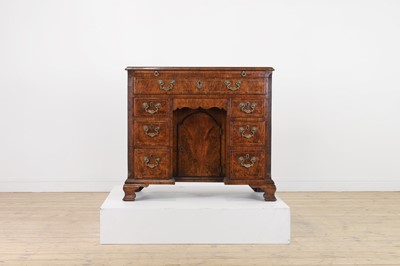 Lot 60 - A George II figured walnut kneehole desk