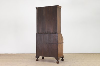 Lot 67 - A George I walnut bureau bookcase in the manner of Coxed & Woster