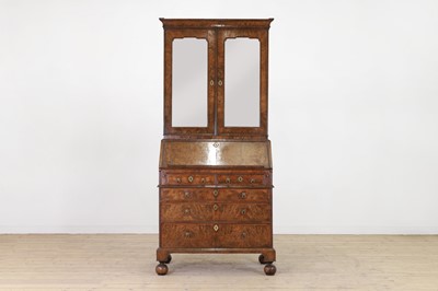 Lot 67 - A George I walnut bureau bookcase in the manner of Coxed & Woster