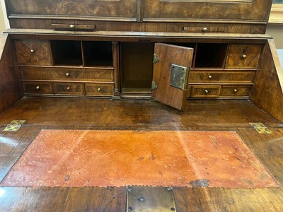 Lot 67 - A George I walnut bureau bookcase in the manner of Coxed & Woster