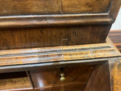 Lot 67 - A George I walnut bureau bookcase in the manner of Coxed & Woster