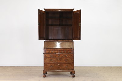 Lot 67 - A George I walnut bureau bookcase in the manner of Coxed & Woster