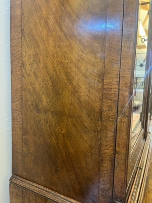 Lot 67 - A George I walnut bureau bookcase in the manner of Coxed & Woster