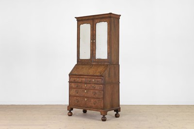Lot 67 - A George I walnut bureau bookcase in the manner of Coxed & Woster