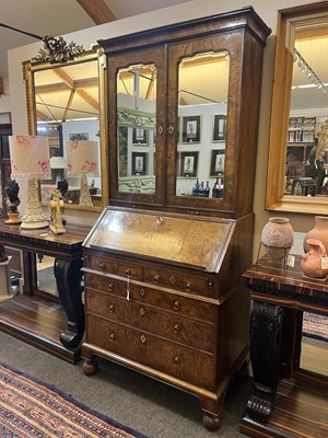 Lot 67 - A George I walnut bureau bookcase in the manner of Coxed & Woster