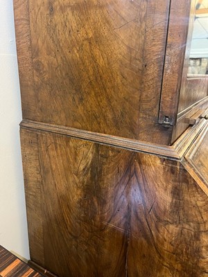 Lot 67 - A George I walnut bureau bookcase in the manner of Coxed & Woster
