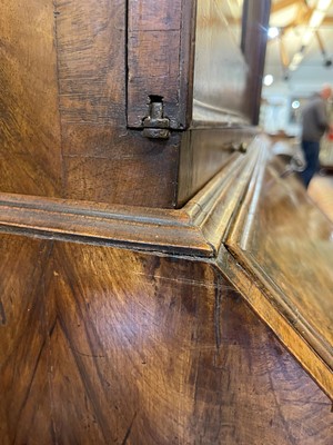 Lot 67 - A George I walnut bureau bookcase in the manner of Coxed & Woster