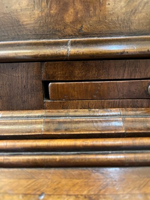 Lot 67 - A George I walnut bureau bookcase in the manner of Coxed & Woster
