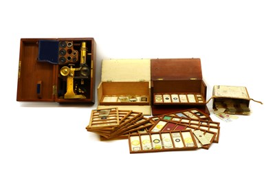 Lot 302 - A cased compound microscope