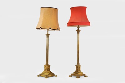 Lot 14 - A near pair of telescopic brass column floor lamps