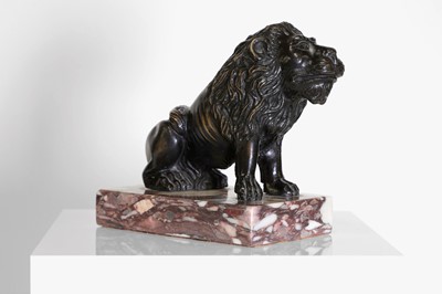 Lot 58 - A bronze model of a crouching lion