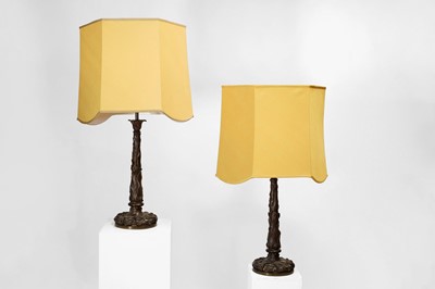 Lot 69 - A pair of patinated bronze table lamps
