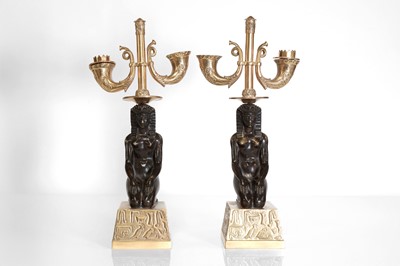 Lot 153 - A pair of Empire-style gilt and patinated bronze candelabra