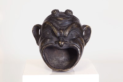 Lot 181 - A patinated bronze oil lamp
