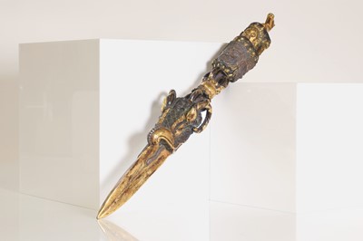 Lot 218 - A Tibetan gilt-bronze phurba