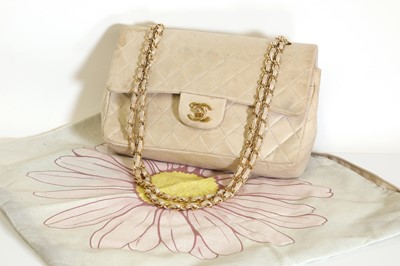 Lot 317 - A Chanel medium cream leather flap bag, c.1980