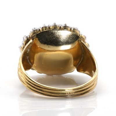 Lot 18 - A foiled topaz and diamond oval cluster ring