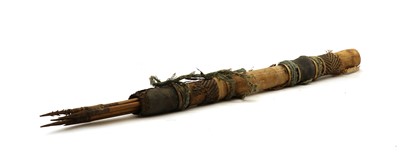 Lot 104A - A cane and leather bound quiver with arrows