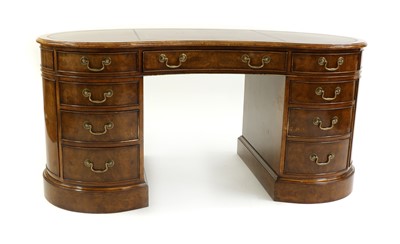 Lot 421 - A burr walnut kidney shaped pedestal desk