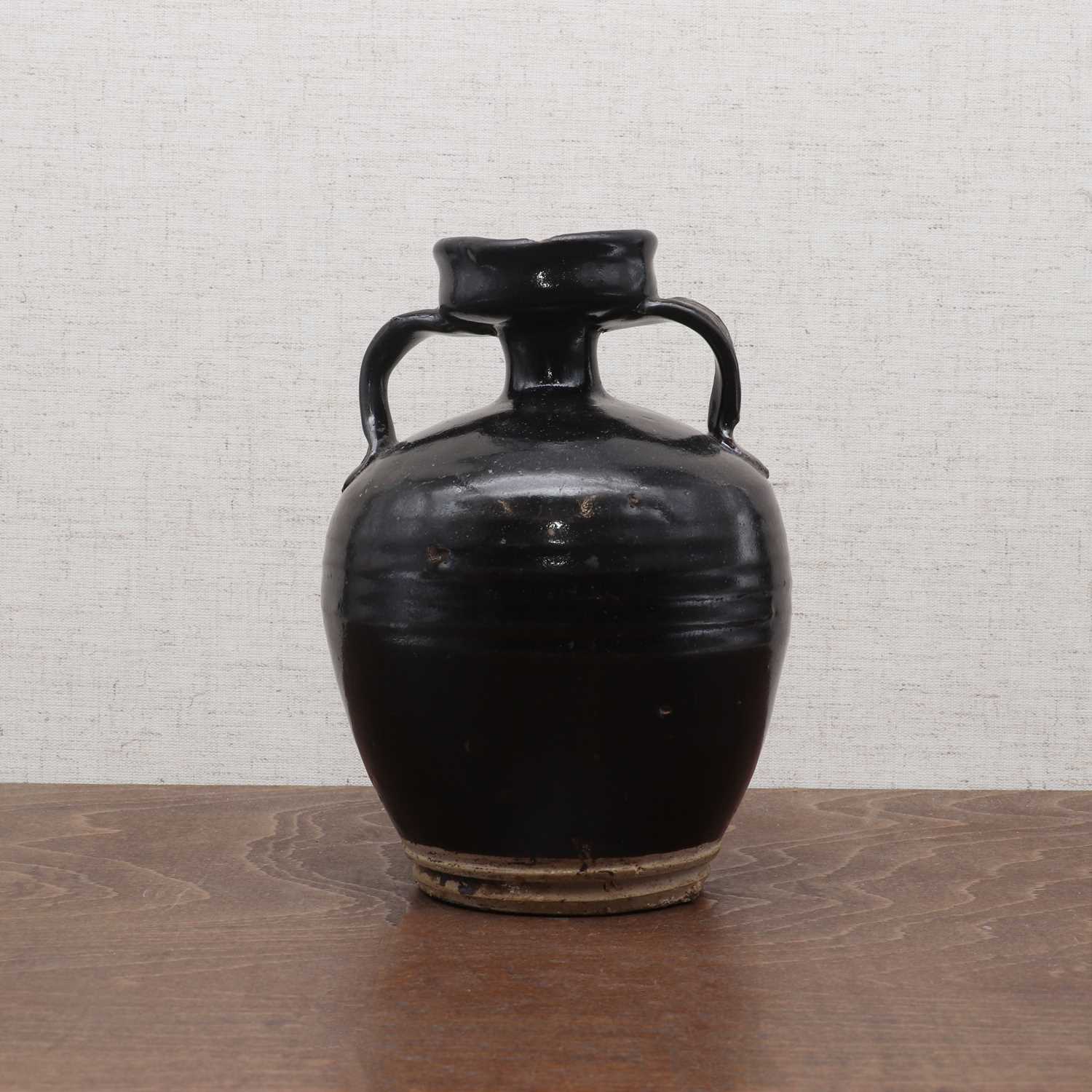 Lot 23 - A Chinese black-glazed vase