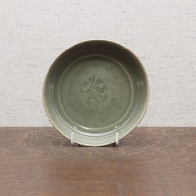 Lot 18 - A Chinese celadon-glazed saucer