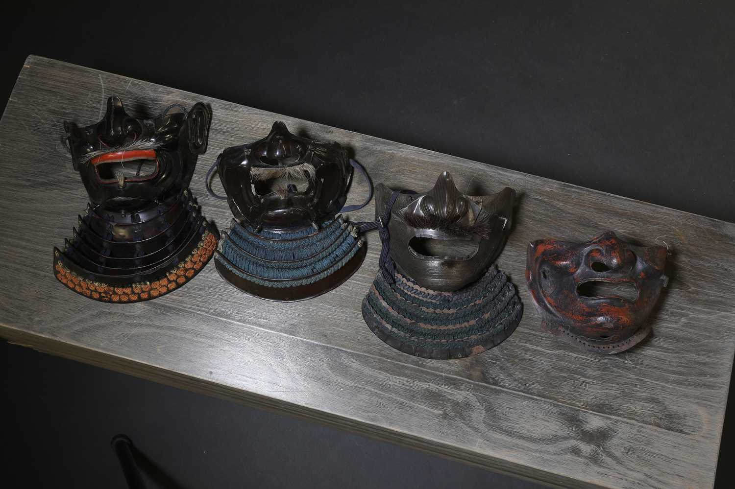 Lot 130 - A group of four Japanese menpo