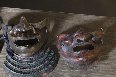 Lot 130 - A group of four Japanese menpo