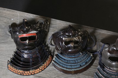 Lot 130 - A group of four Japanese menpo