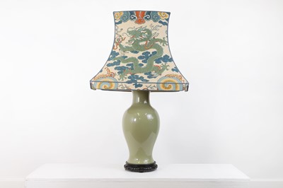 Lot 376 - A celadon-glazed pottery lamp