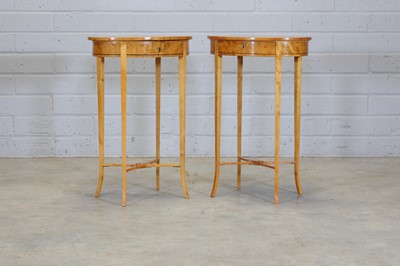 Lot 536 - A matched pair of birch occasional tables in the Biedermeier style