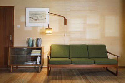 Lot 462 - A Danish teak three-seater settee and stool