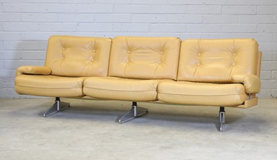 Lot 448 - A mustard yellow leather three-seater settee