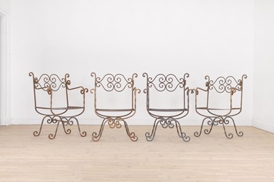 Lot 430 - A set of four wrought-iron garden chairs