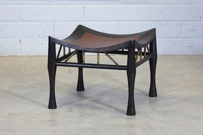 Lot 89 - An ebonised Thebes stool