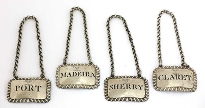 Lot 72 - A set of four George III silver wine labels
