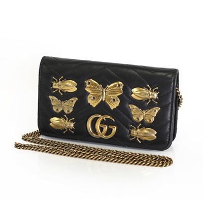 Lot 1579 - A Gucci black leather Marmont bug wallet, on chain