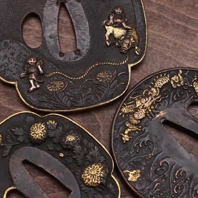 Lot 309 - Three Japanese gilt-bronze tsuba