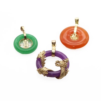 Lot 1282 - Three gold hardstone pendants