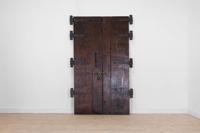 Lot 143 - A pair of carved hardwood doors in the French Louis XV-style