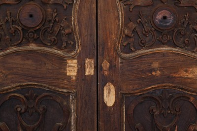 Lot 143 - A pair of carved hardwood doors in the French Louis XV-style